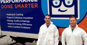 two SmartHouse techs in front of work truck