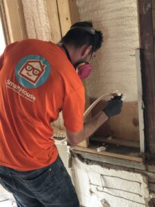 smarthouse tech installing spray foam insulation