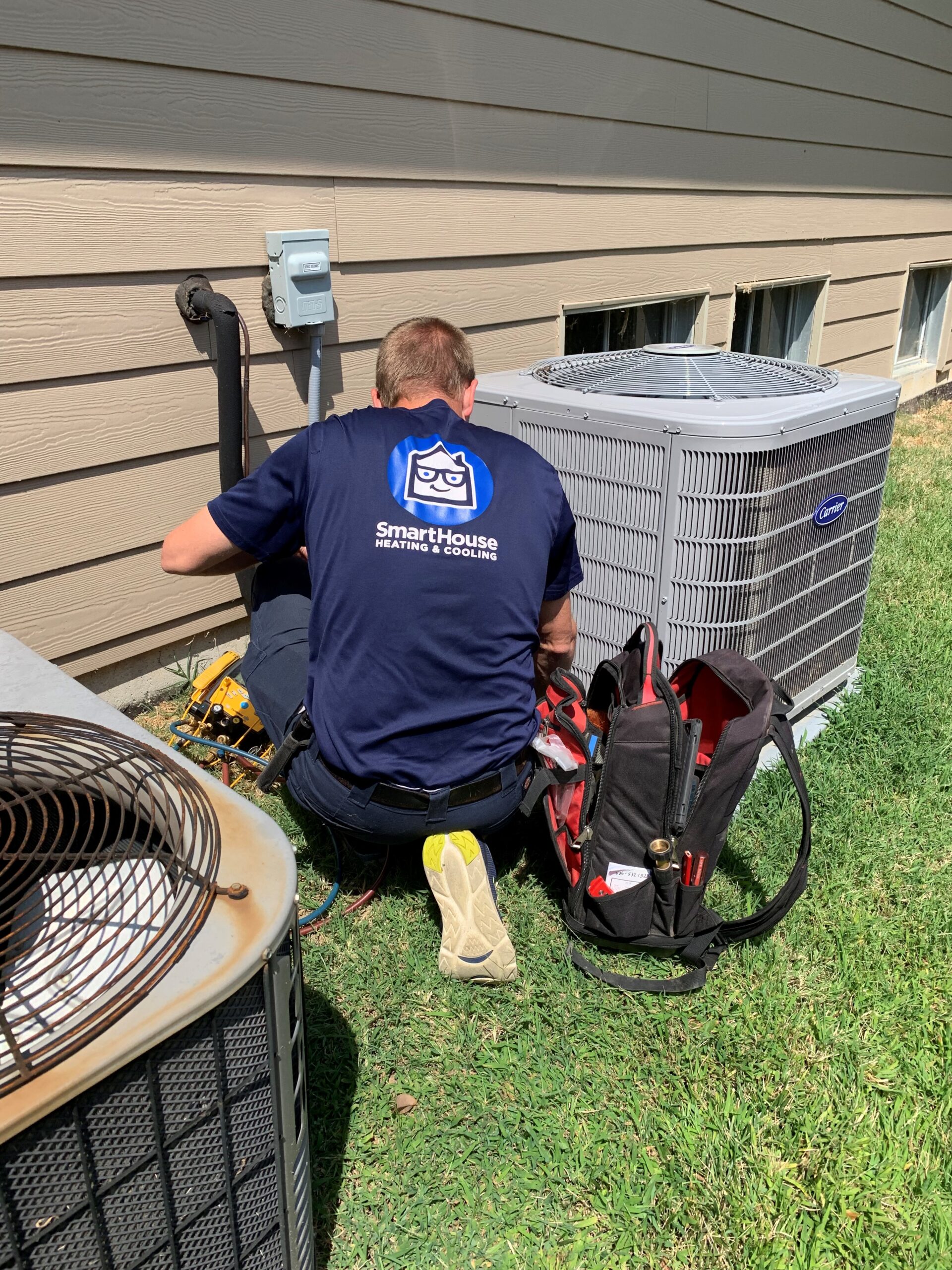 smarthouse tech cleaning ac unit outside