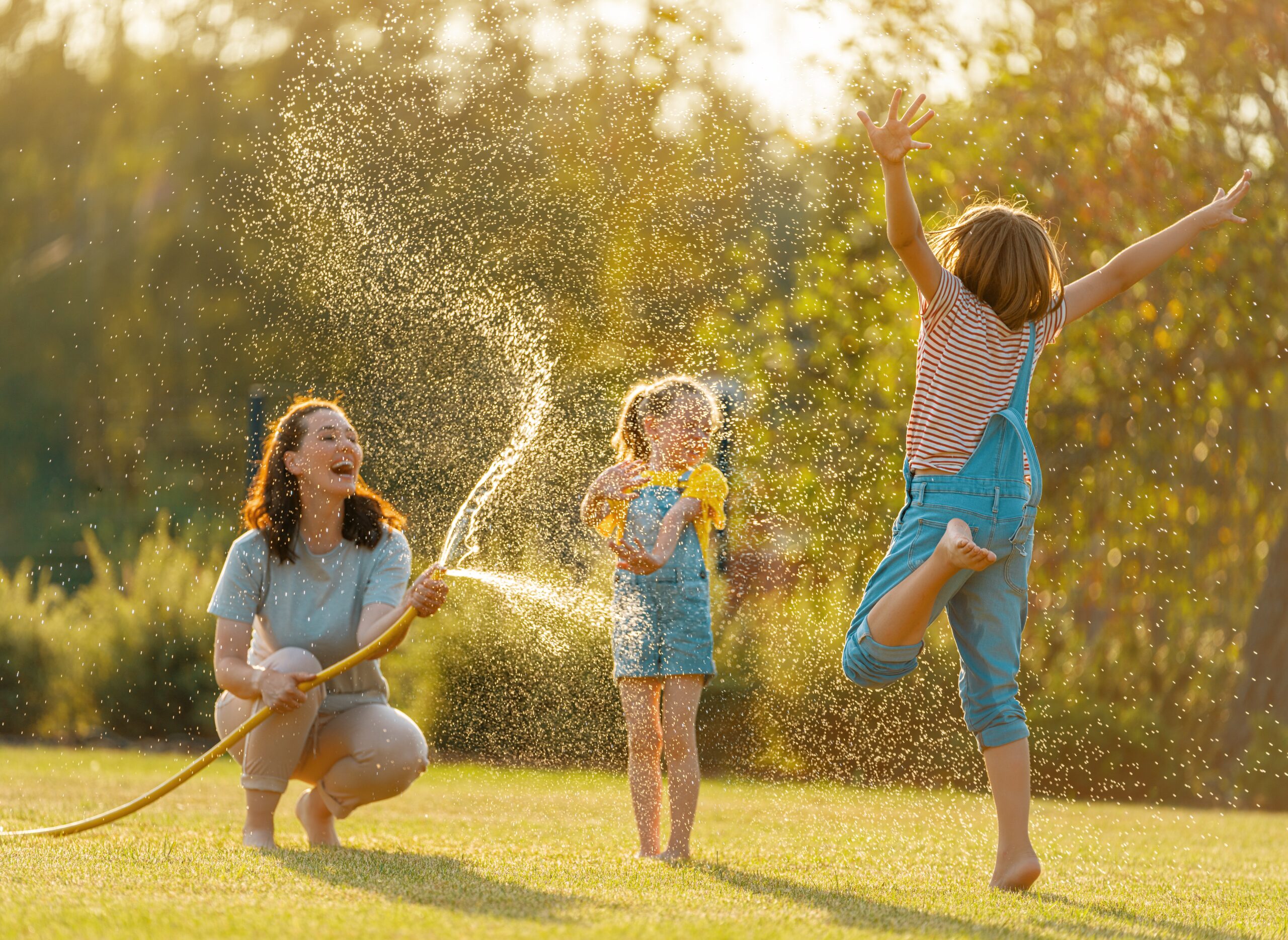 Family playing outside in summer